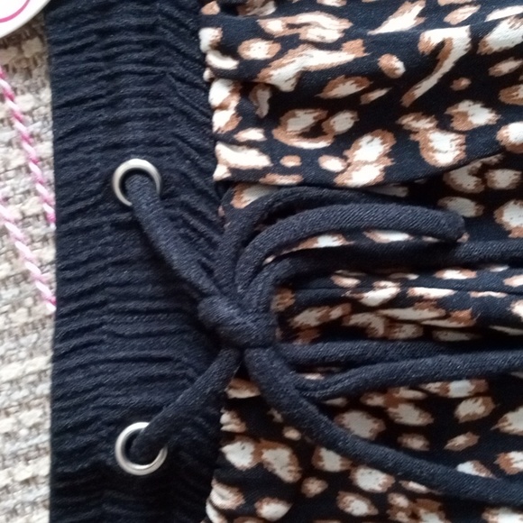 Umgee medium animal print front, solid black cheeky shorts with fringed hem. NWT - Picture 2 of 7